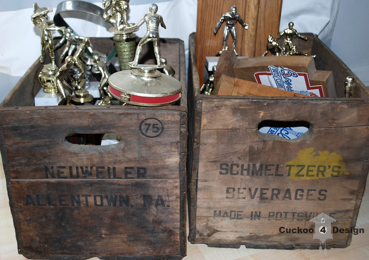old crate filled with trophies and awards