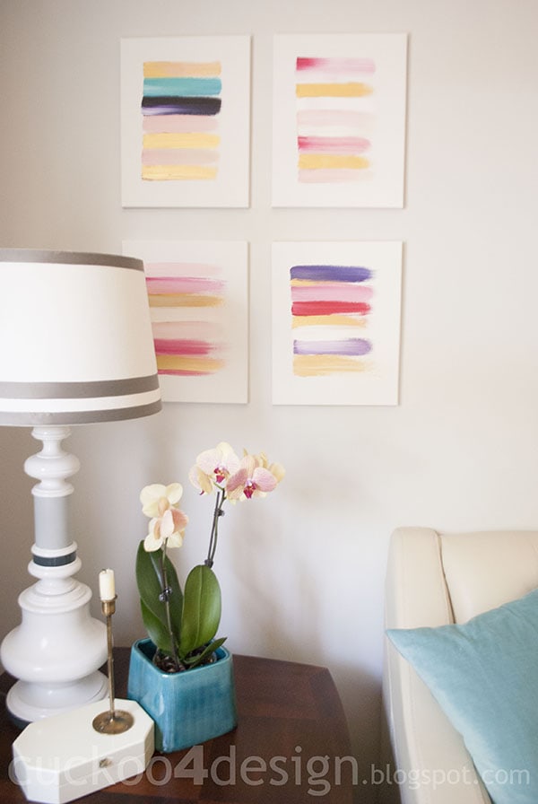groupin gof abstract brushstroke paintings in pink, gold and white
