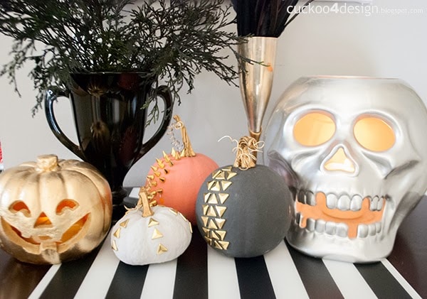 gold studded pumpkins and large silver skull