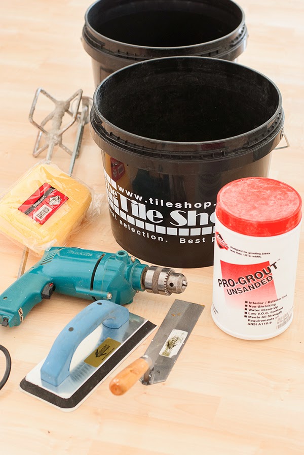 supplies and tools used to install marble subway tile backsplas