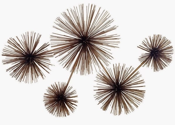 cluster of urchin shaped Curtis Jere wall sculptures