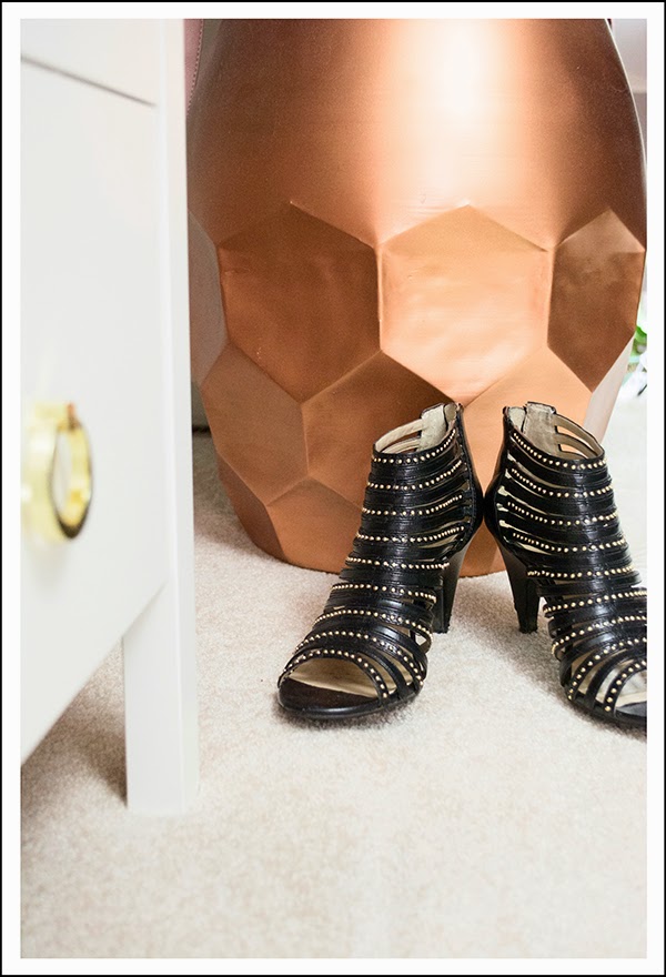 shoes in front of copper stool