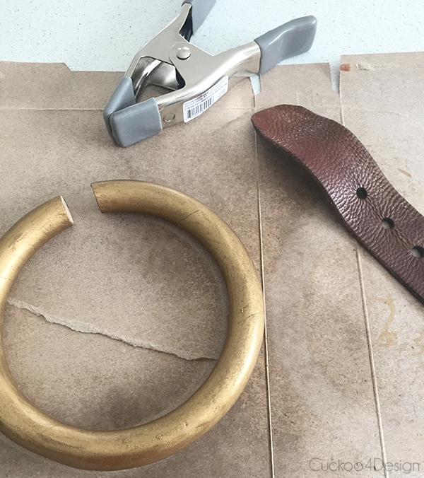 open ring and leather belt before assembling the DIY towel holder