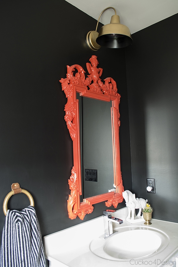 red painted vanity mirror and gold painted vanity light