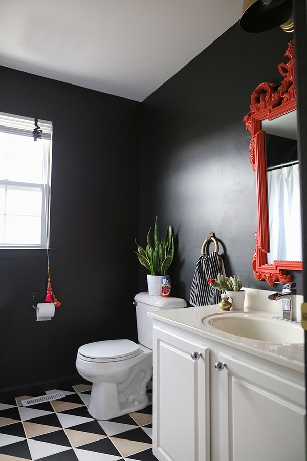 black bathroom with graphic patterned tile