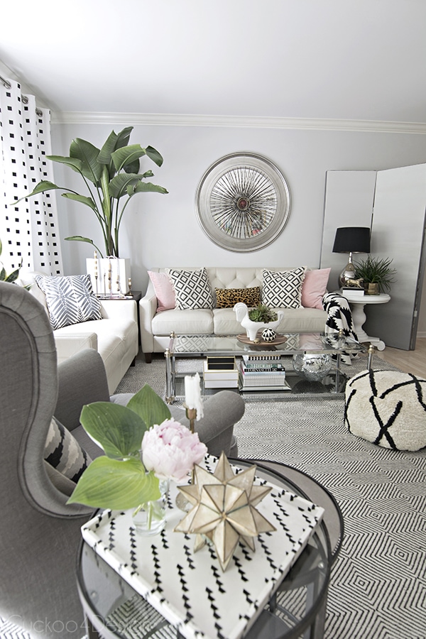 neutral eclectic summer living room with hints of pink