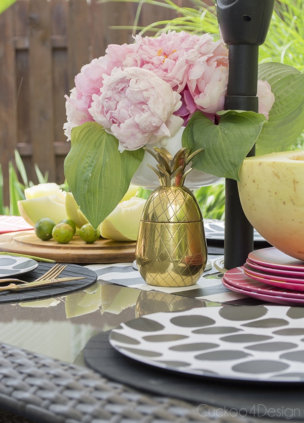 brass pineapple on outdoor dining table