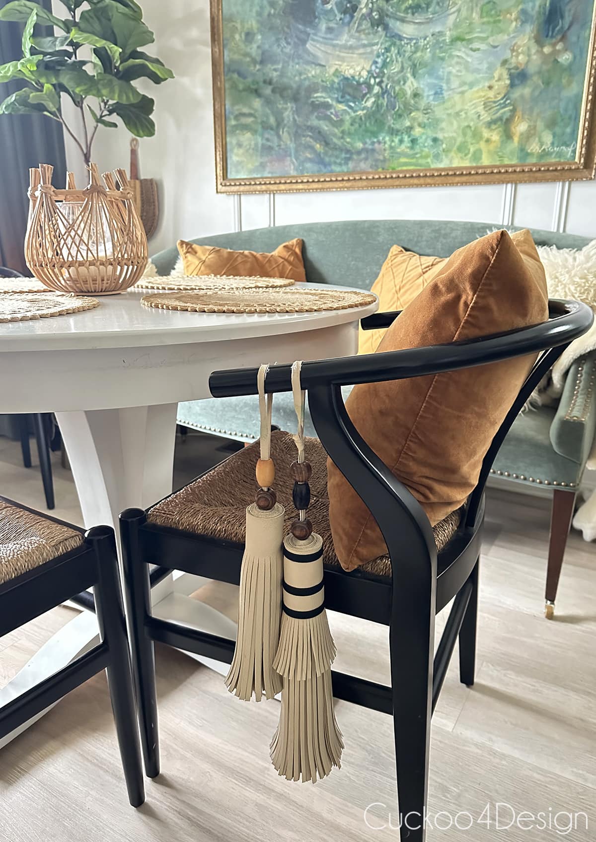 two leather tassels hanging on dining room chair