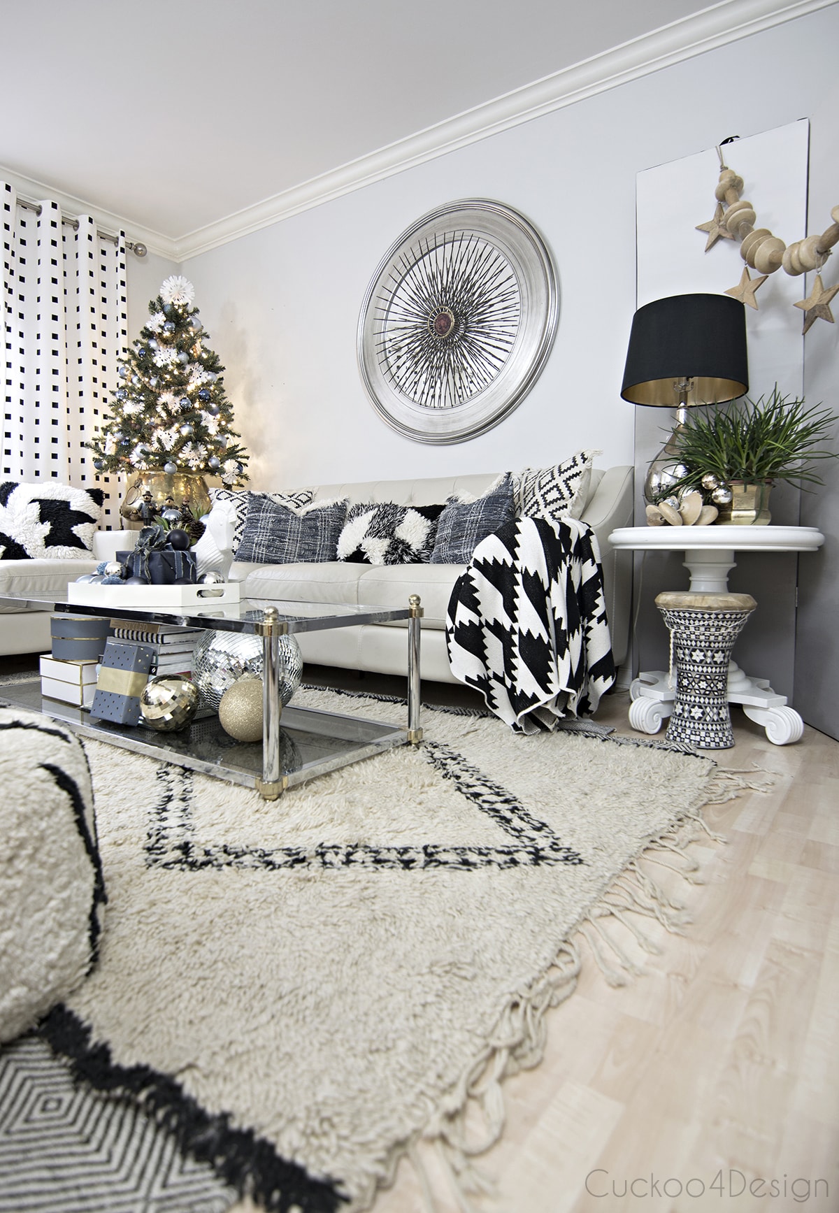 black and white neutral living room with beni ourain rug and jeans accents