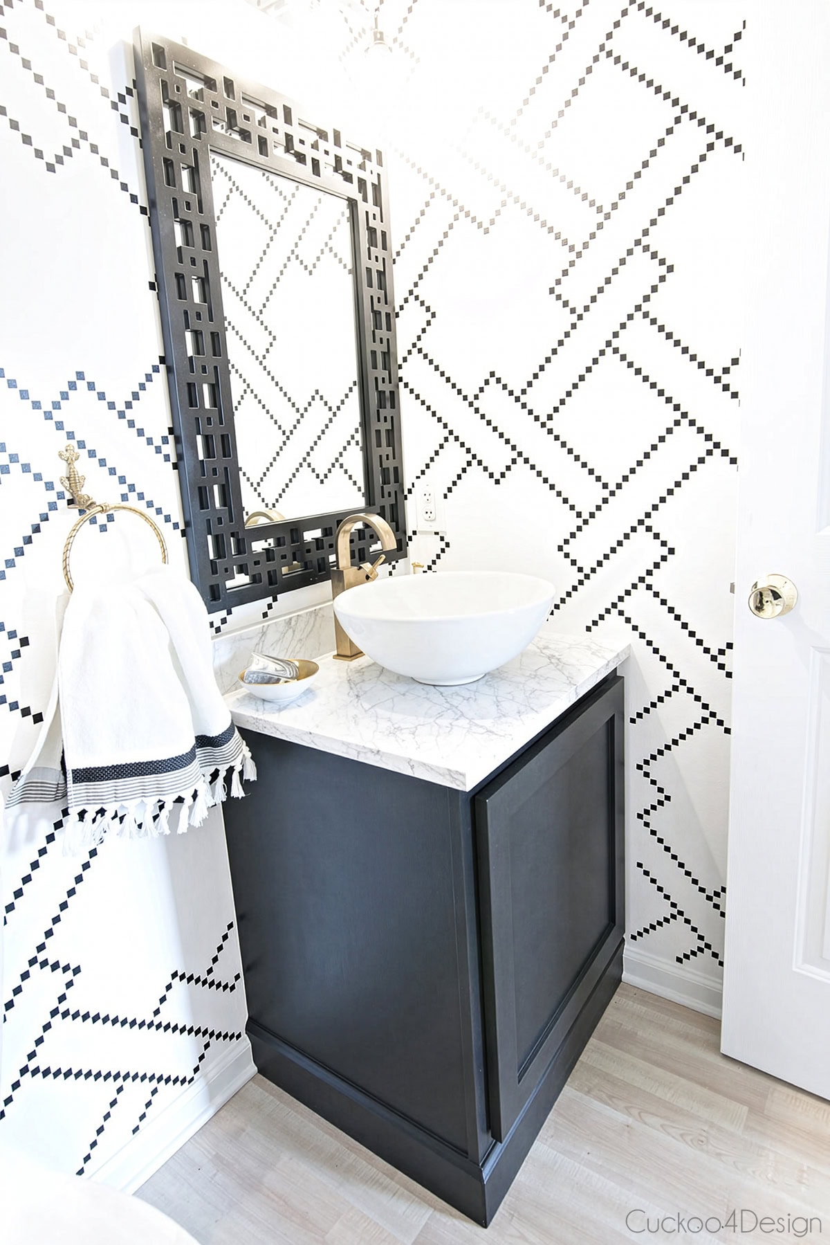 bathroom vaniry after kick plate makeover painted in black