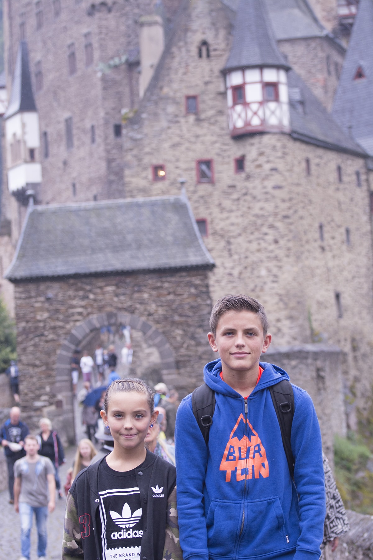 my kids standing in front of Eltz castle