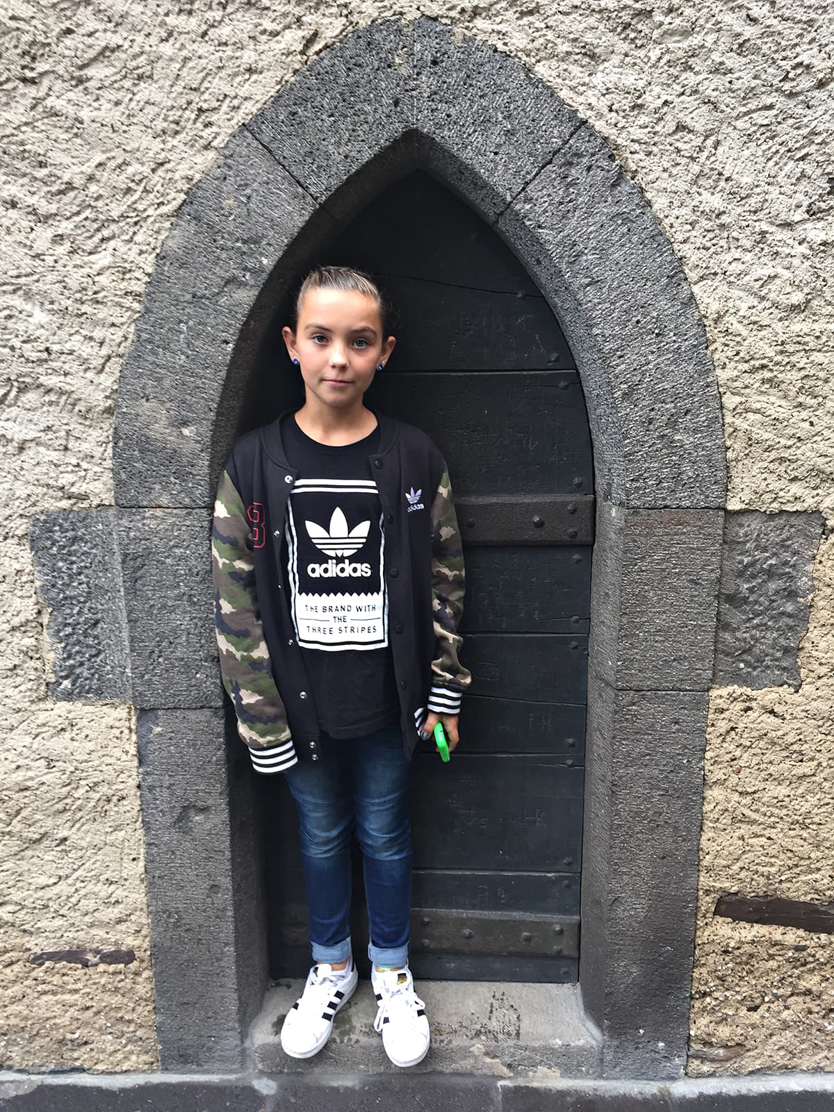girl standing in small door frame of Eltz castle