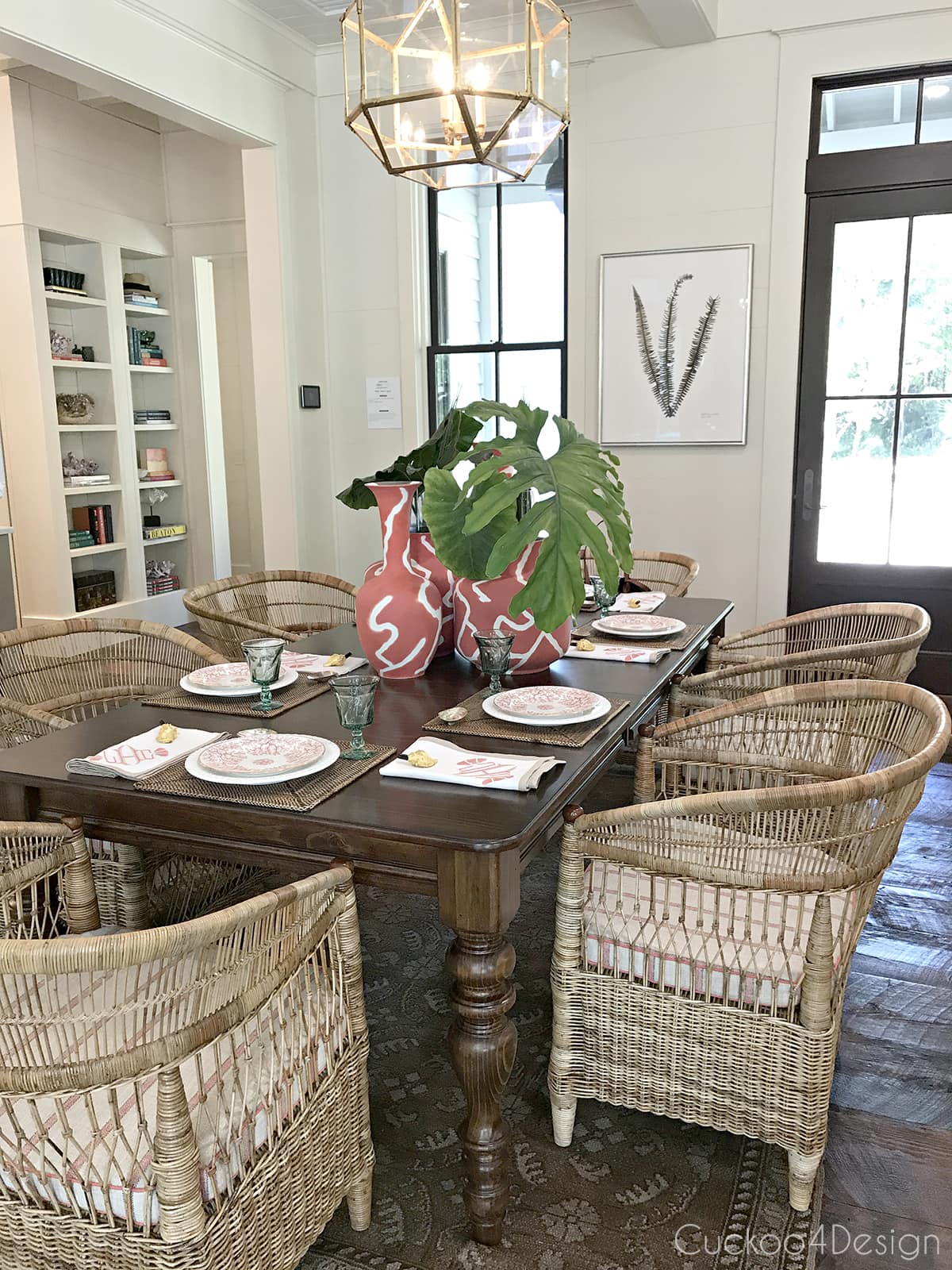 dining room with large rattan arm chairs
