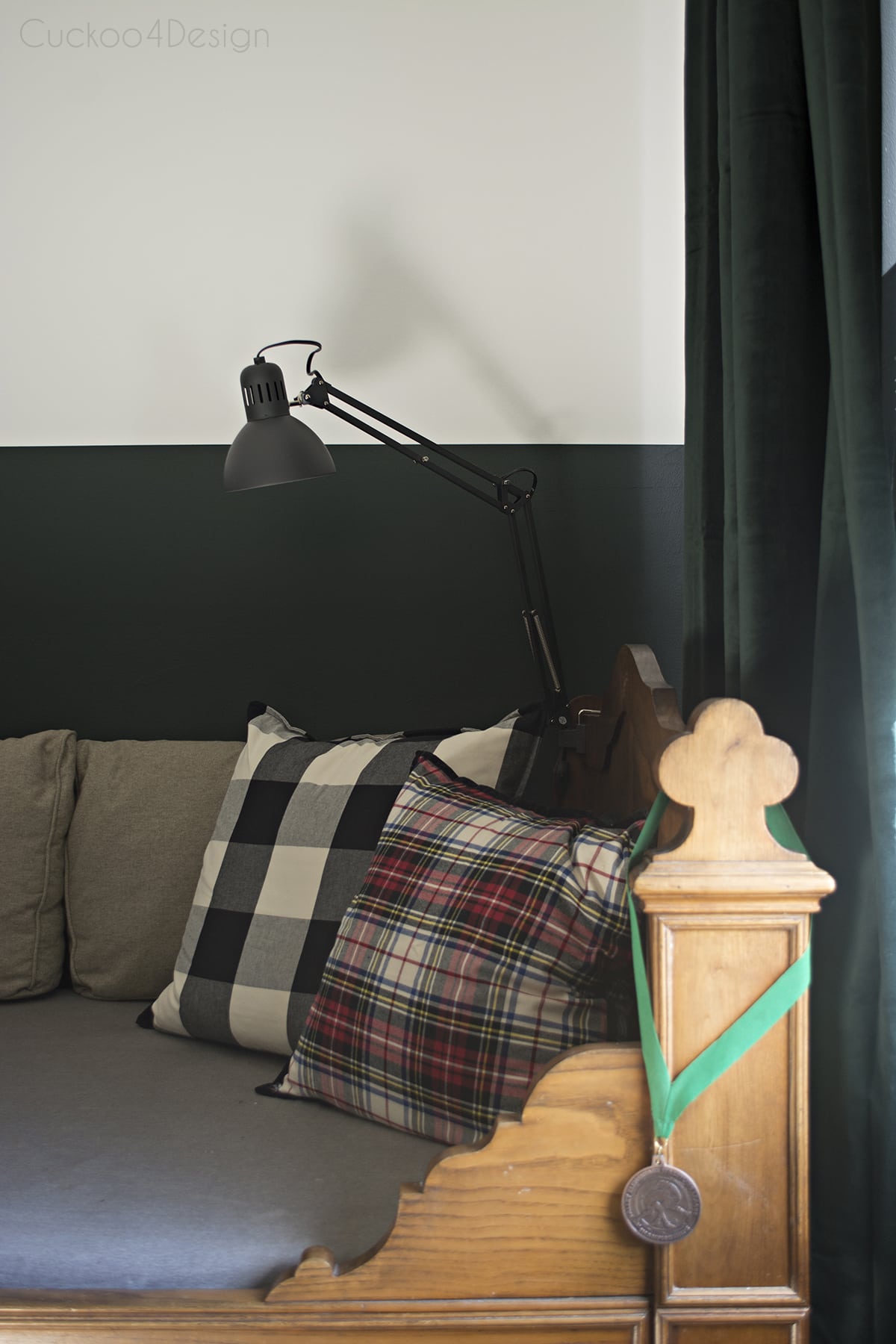 sophisticated boy's room with dark green walls and flags