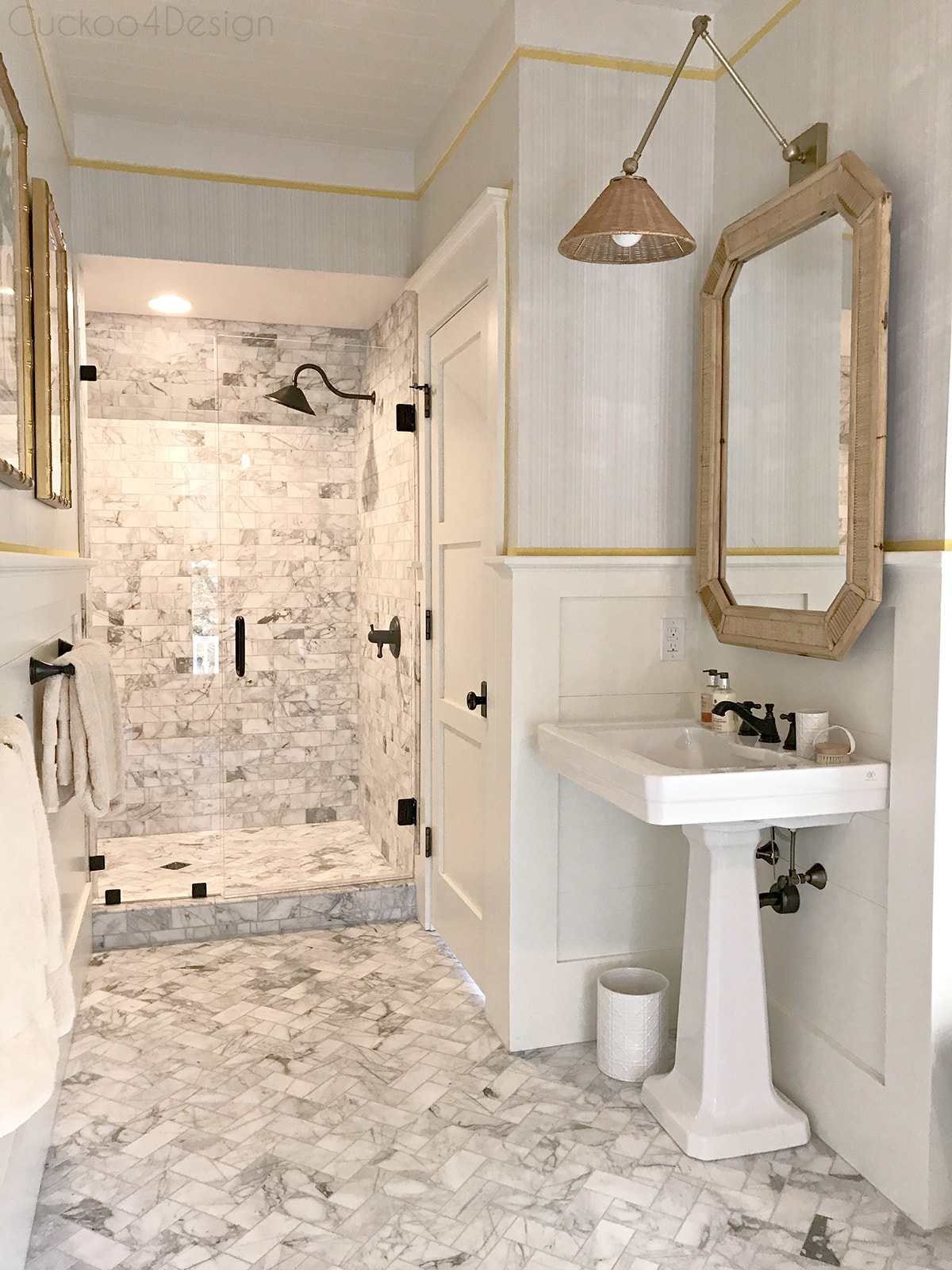 marble master bathroom and wicker rattan accents