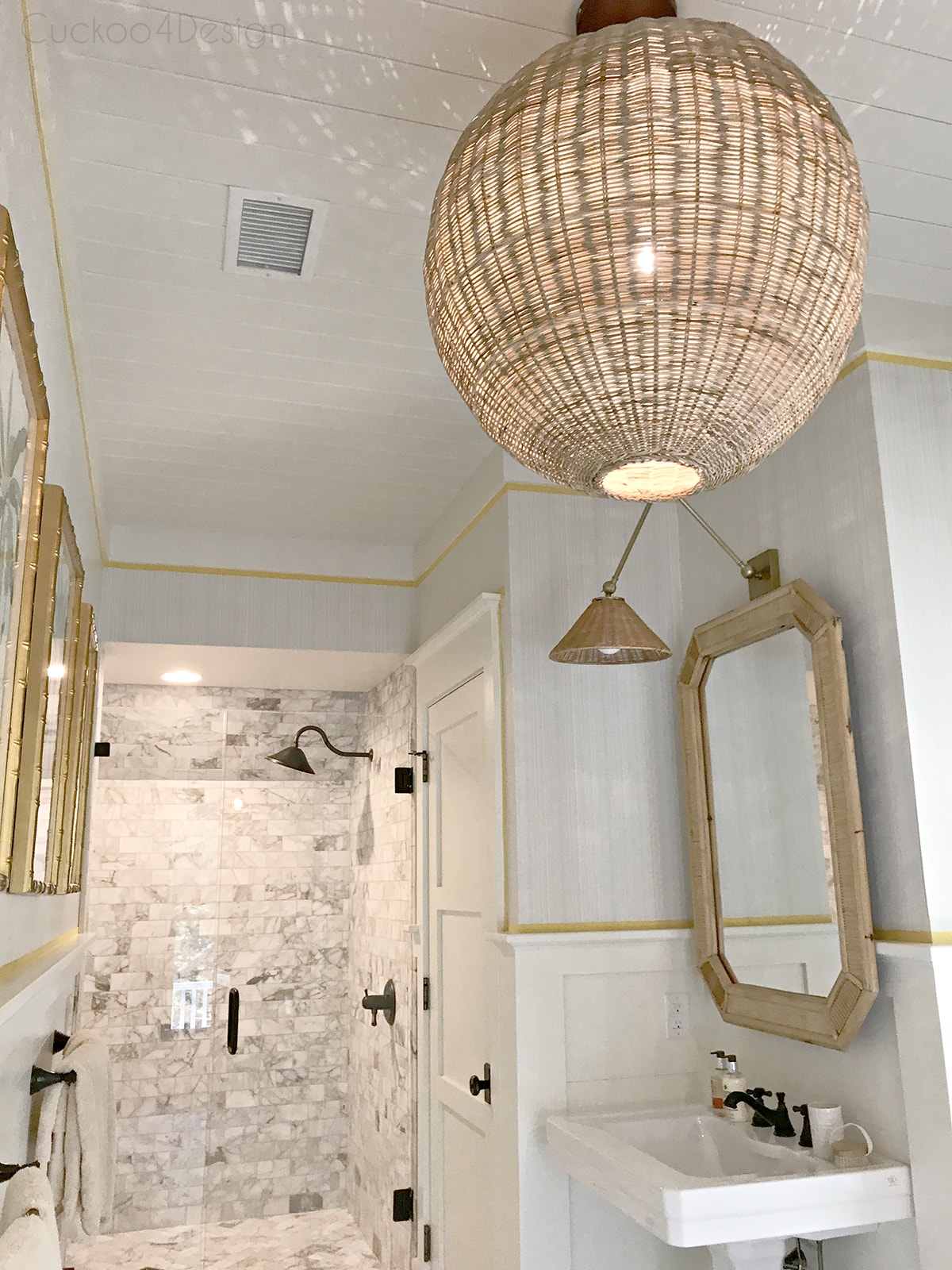 marble master bathroom and hicker rattan accents