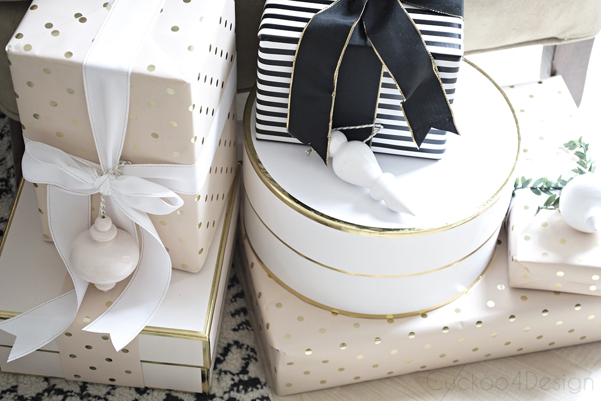 vignette of gifts with blush, white and gold wrapping papered gifts