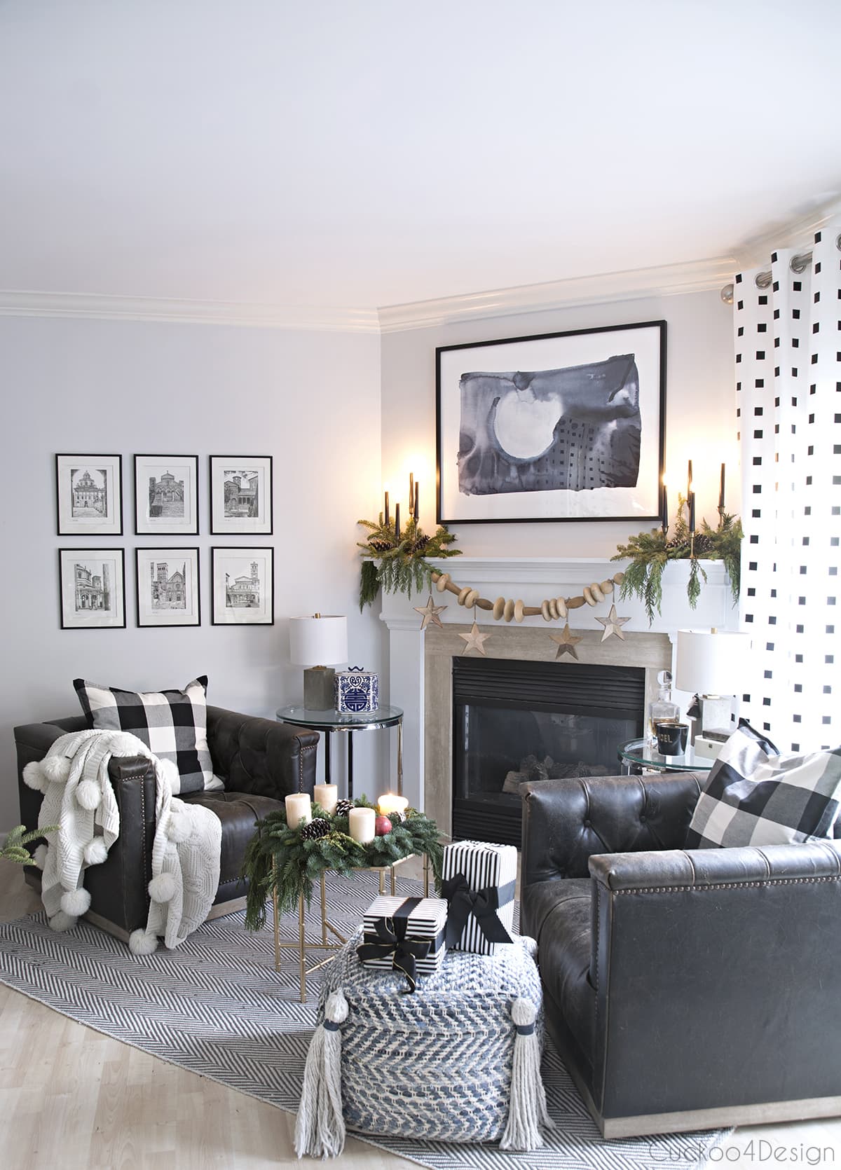 blue, black and white fireplace area with leather swivel chair and natural Christmas decor
