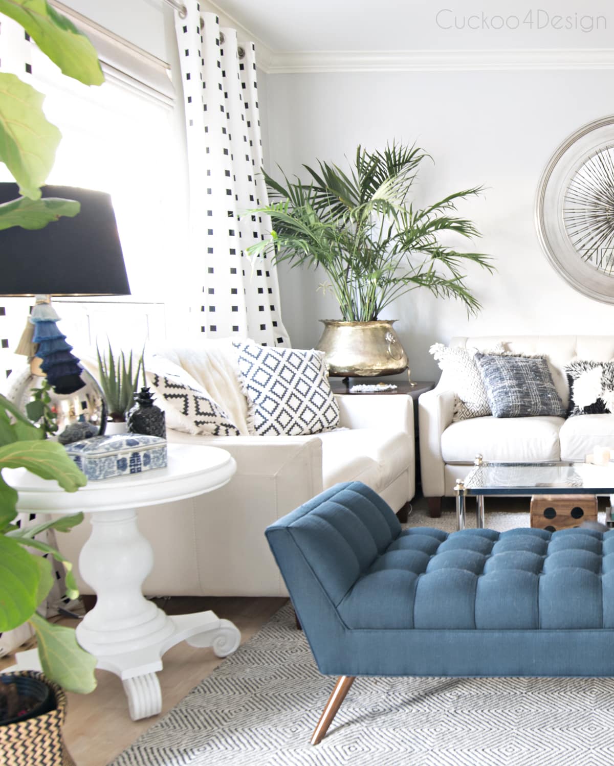 mid century modern blue button tufted chaise in eclectic European living room