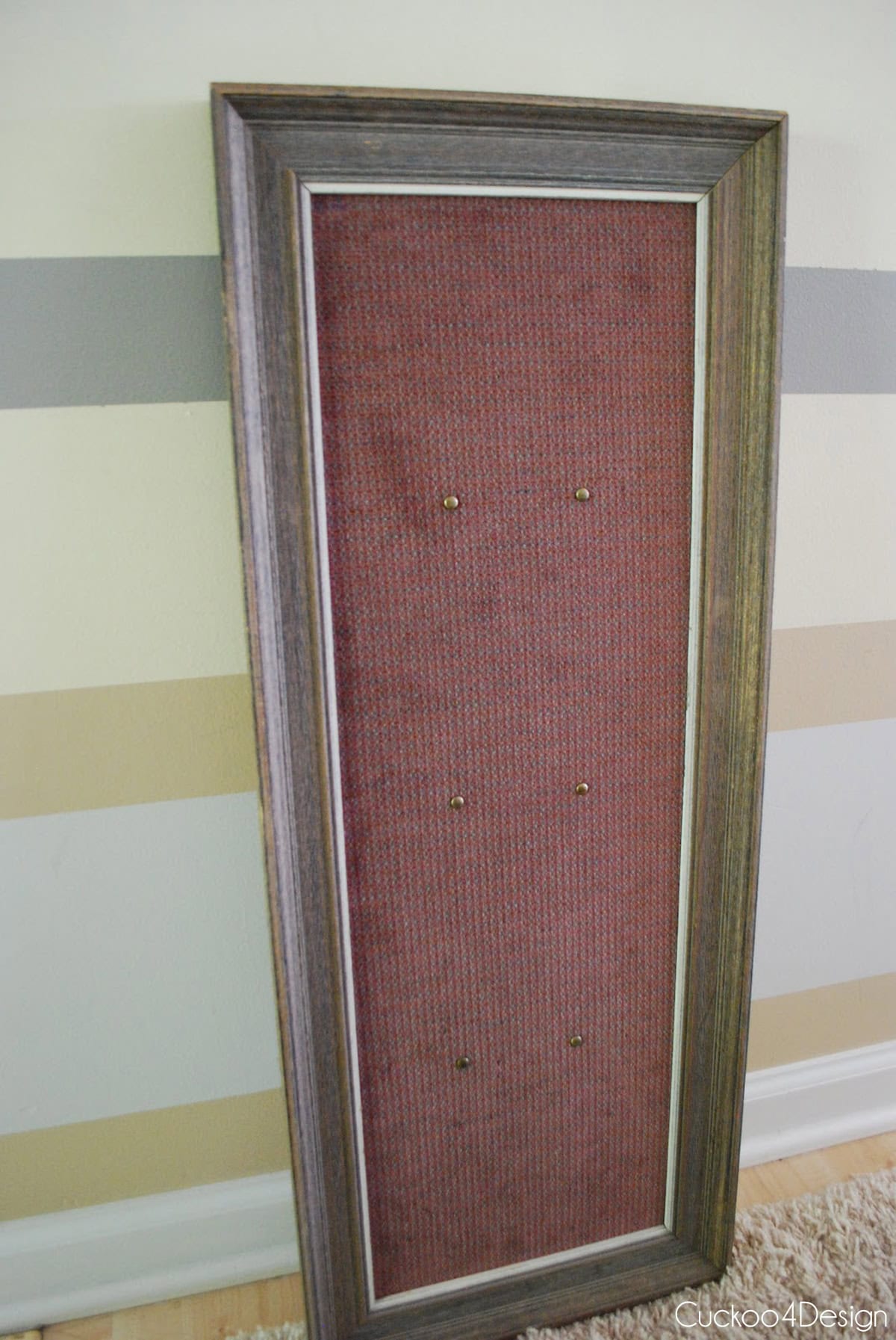 thrifted frame leaning against the wall