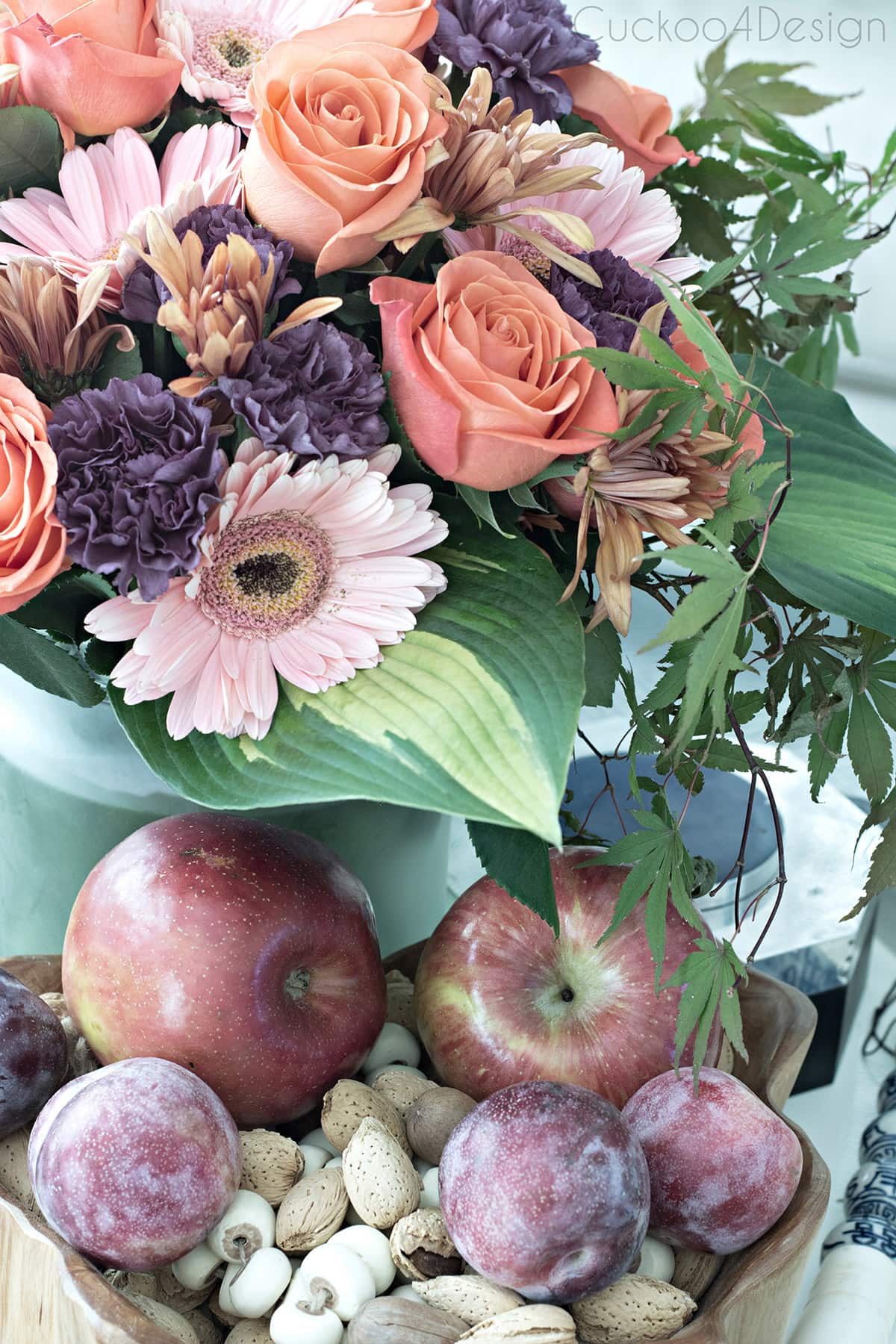 beautiful early fall flower arrangement with fall colored roses inspired by apples and plums 