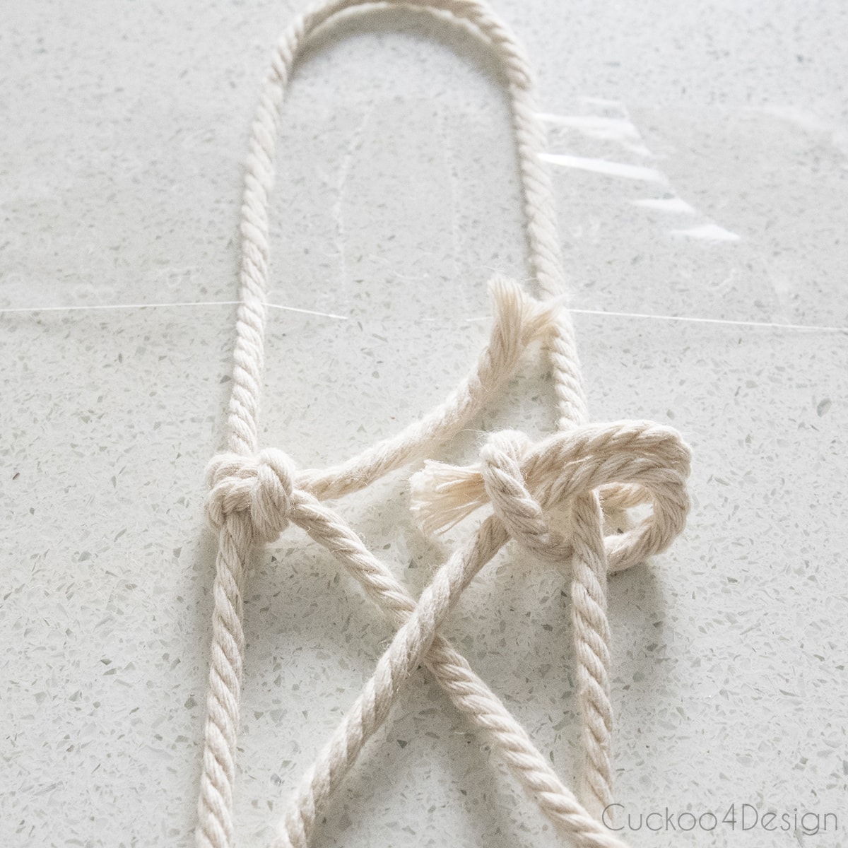 lark head knots on each side to start wrapping a stone