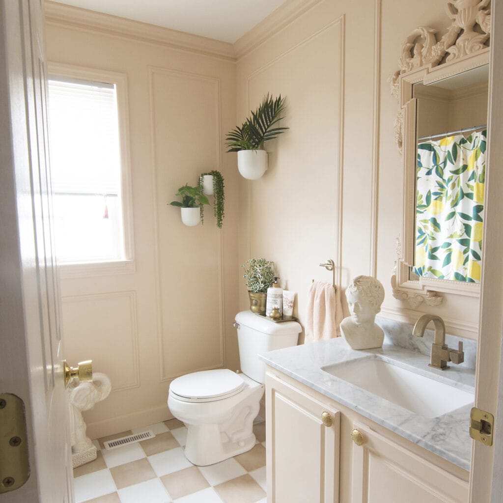 blush colored bathroom with checkerboard tile