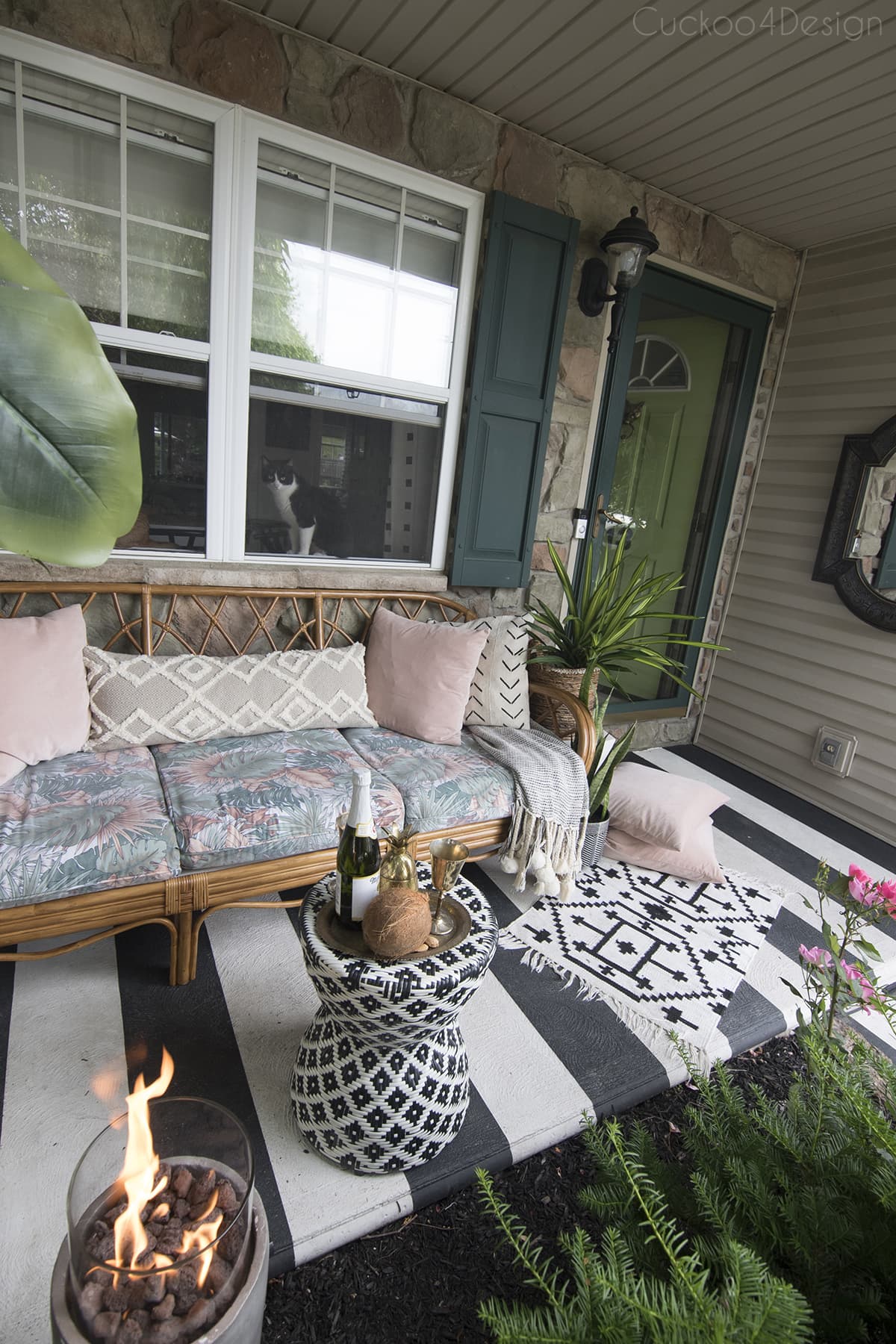 modern porch with vintage rattan sofa