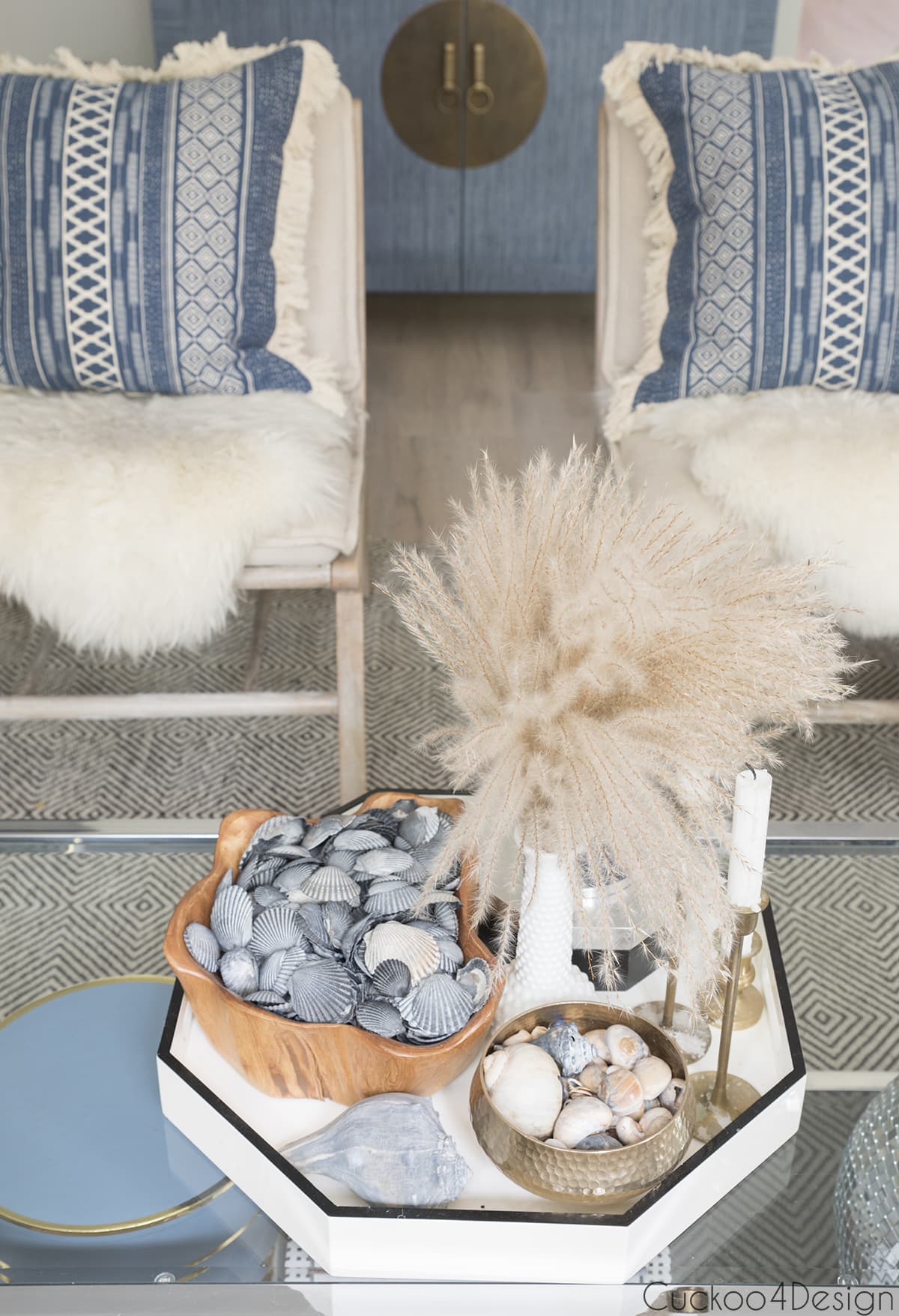 accent chairs with blue tribal and fringe pillows