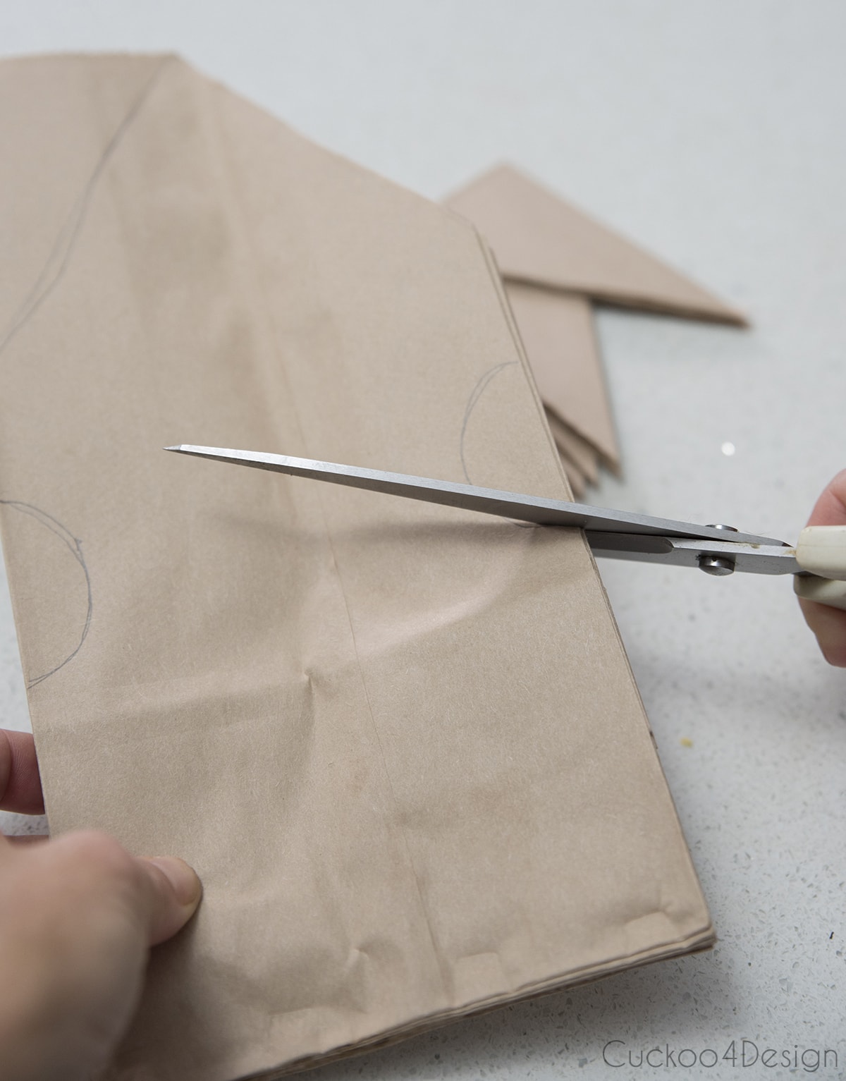 cutting the 3D paper bag snowflake pattern
