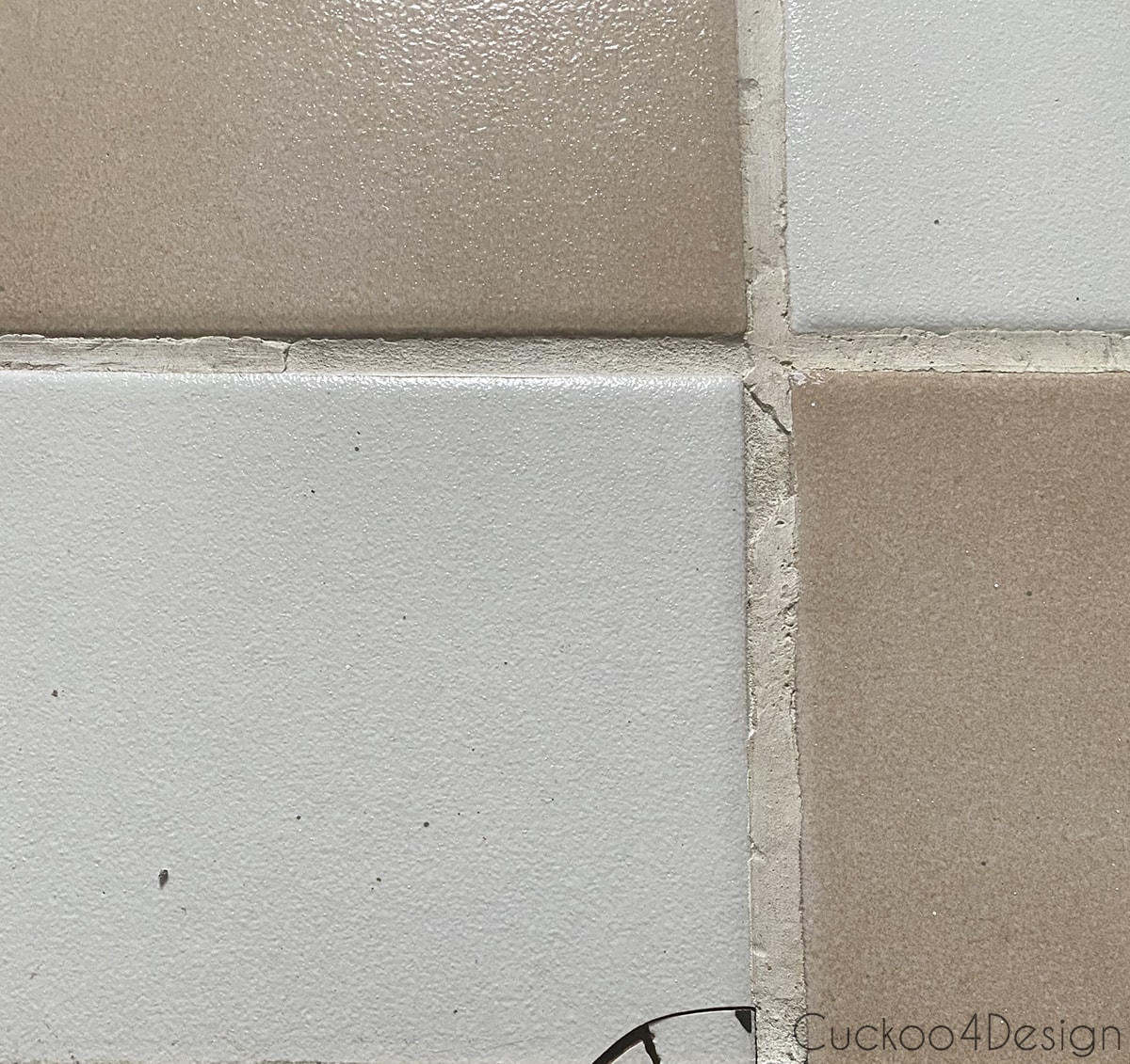 dirty old tiles and grout with cracks