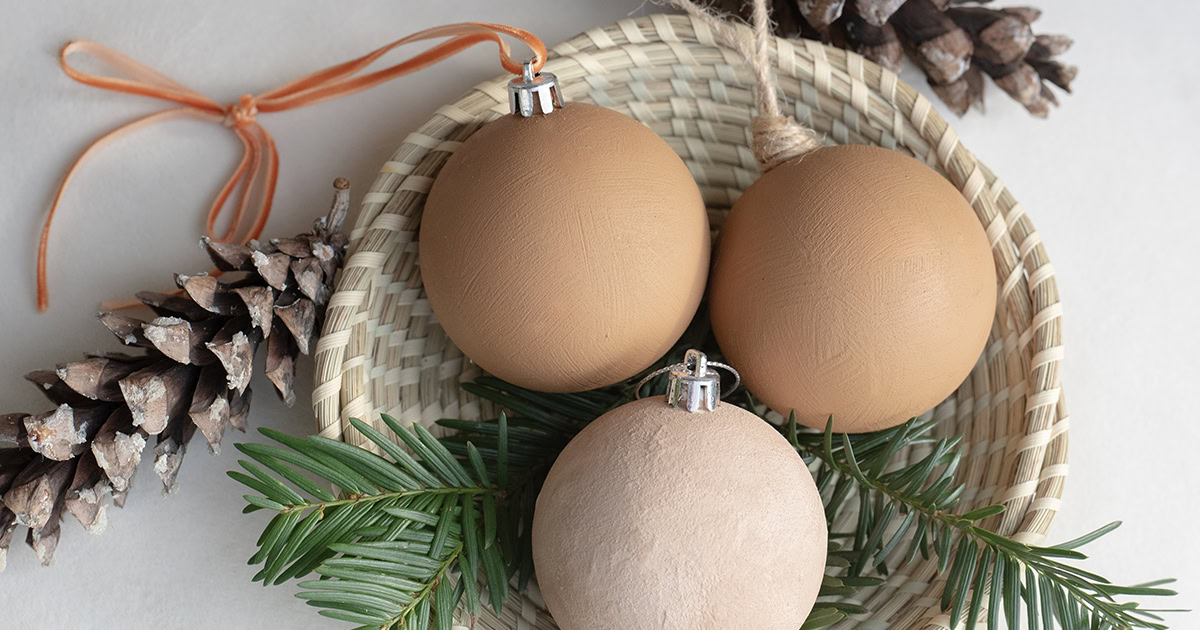 close-up of three different colored DIY baking soda paint ornaments
