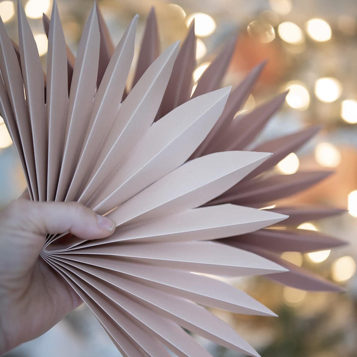 Easy and affordable paper fan decorations inspired by faux sun palm leaves