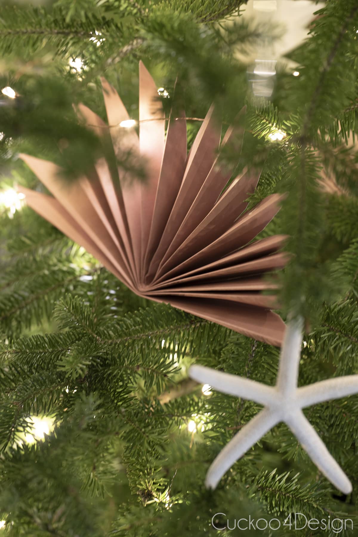 close up of faux palm leaf paper fan ornaments