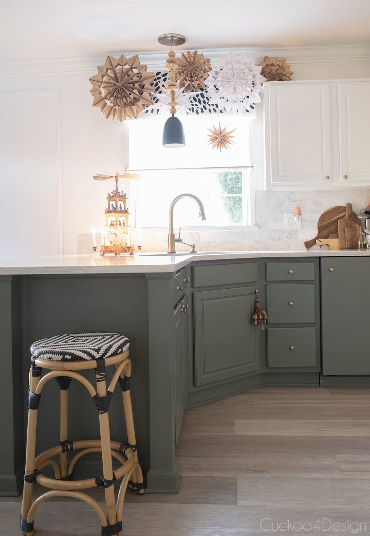 two-toned green and white kitchen with paper snowflakes for Christmas