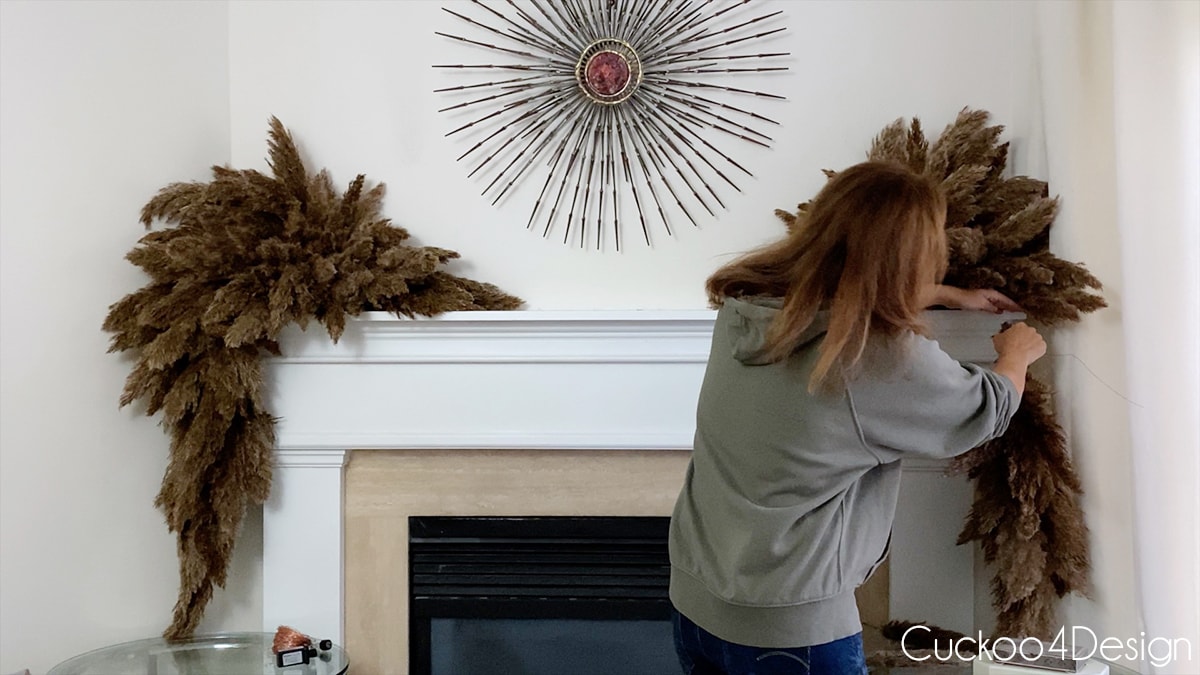 hang the long garland pieces with wire loop on both corners of mantle