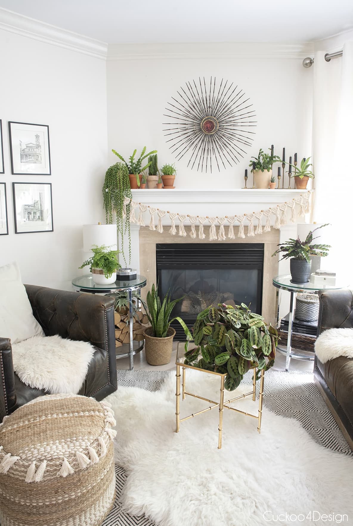 boho fireplace decor with lots of plants and Curtis Jere wall sculpture hanging over fireplace