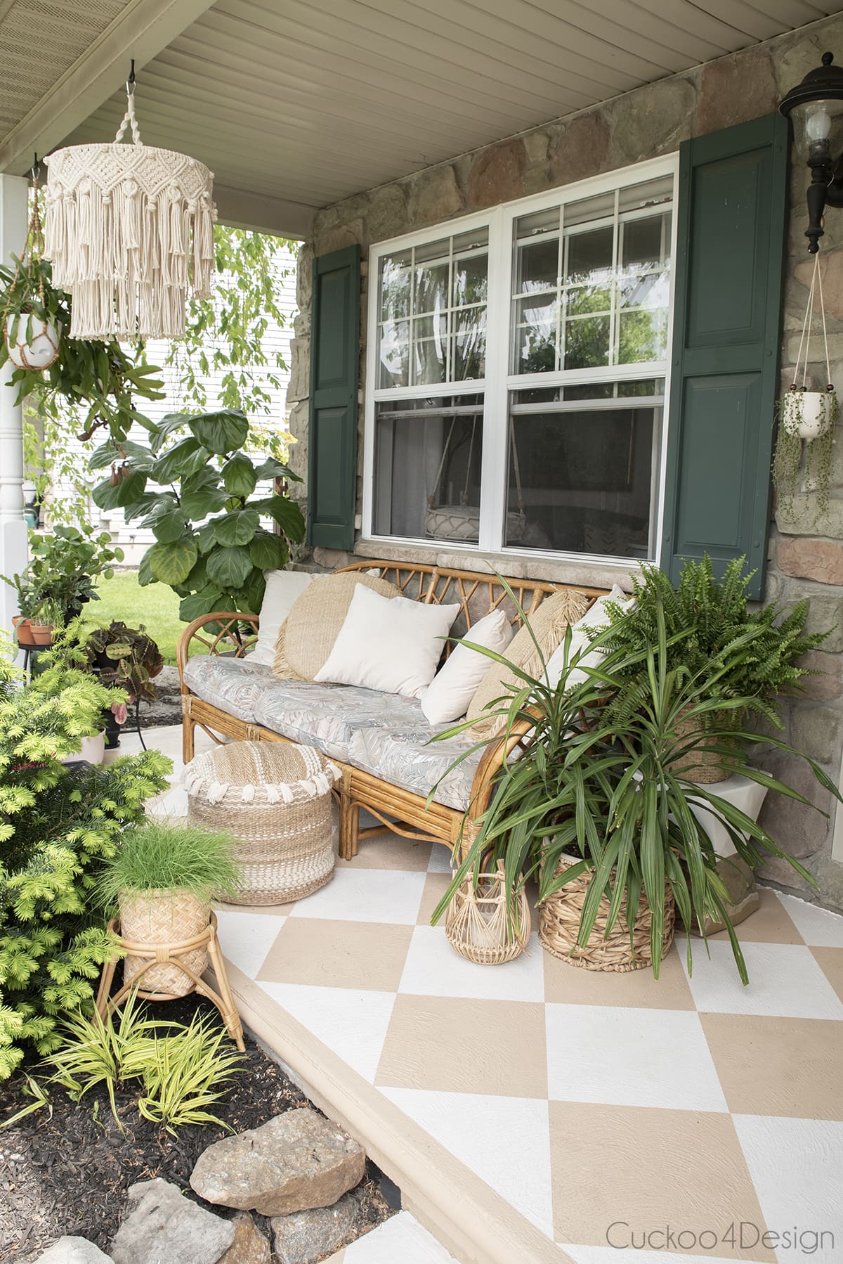 boho vibe on painted concrete porch with handmade macrame chandelier