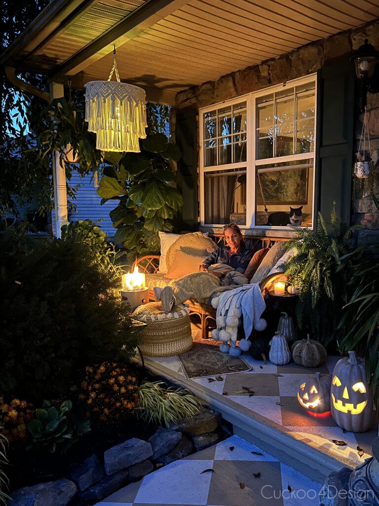 sitting on my cozy fall porch with a blanket and fireplace
