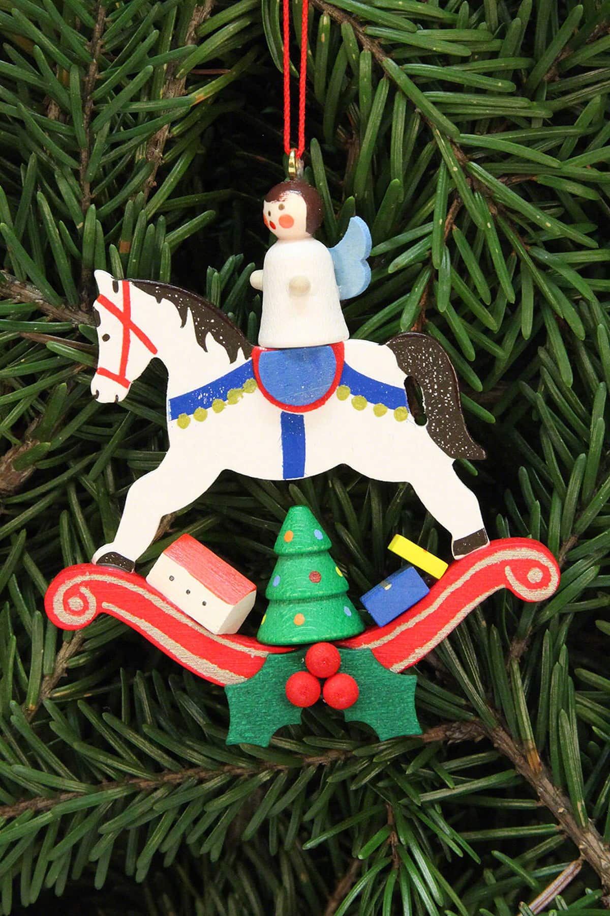 German Christmas tree ornament angel on rocking horse