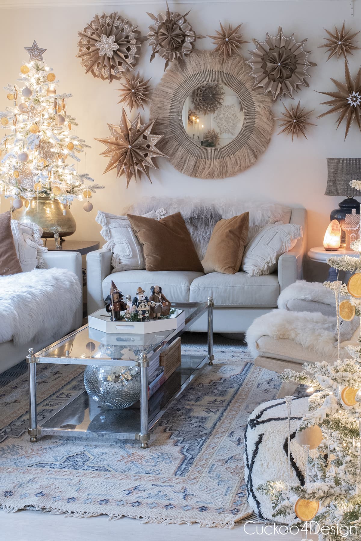 gingerbread snowflakes hanging above round mirror in living room