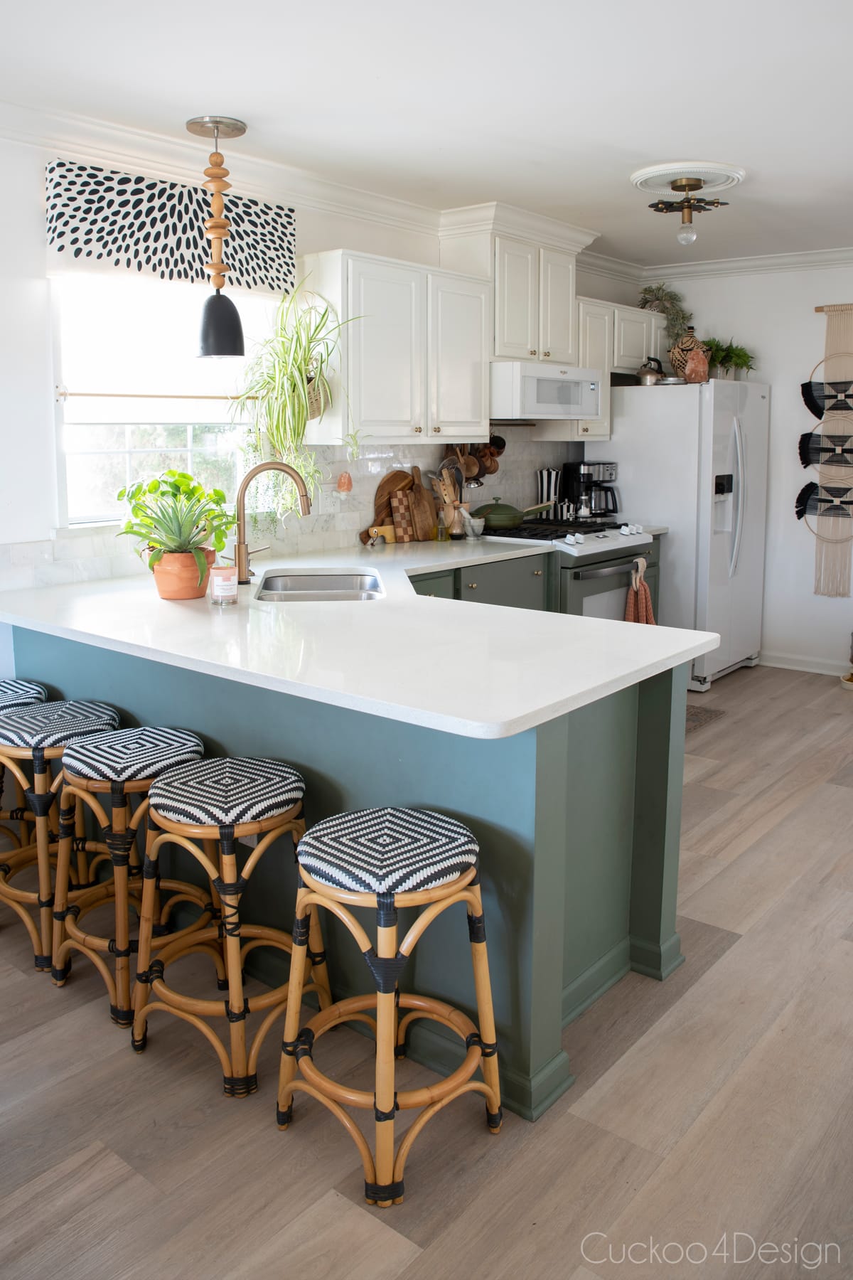 Valspar Lush Sage kitchen cabinets and Texas White Ash Karndean vinyl plank flooring