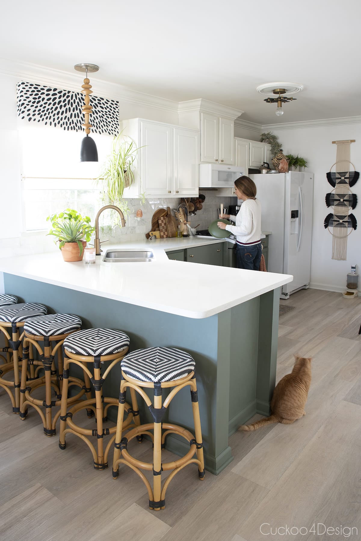 new green kitchen cabinets with rattan counter stools and wooden kitchen accents