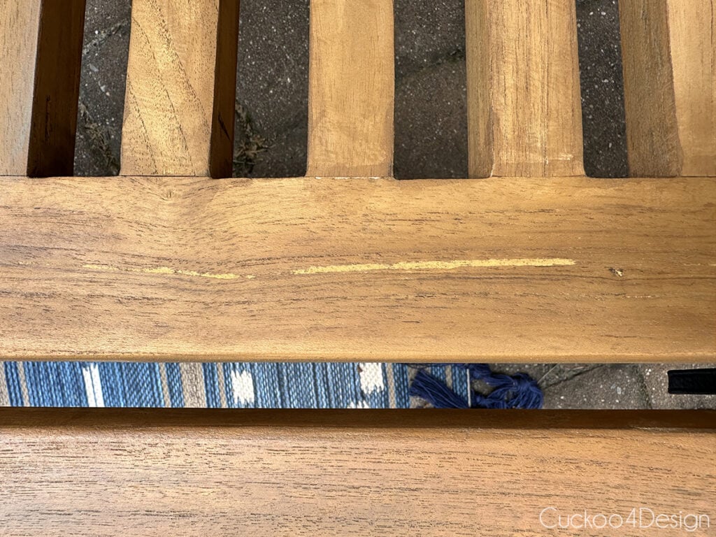 filling a crack in teak wood with outdoor wood filler