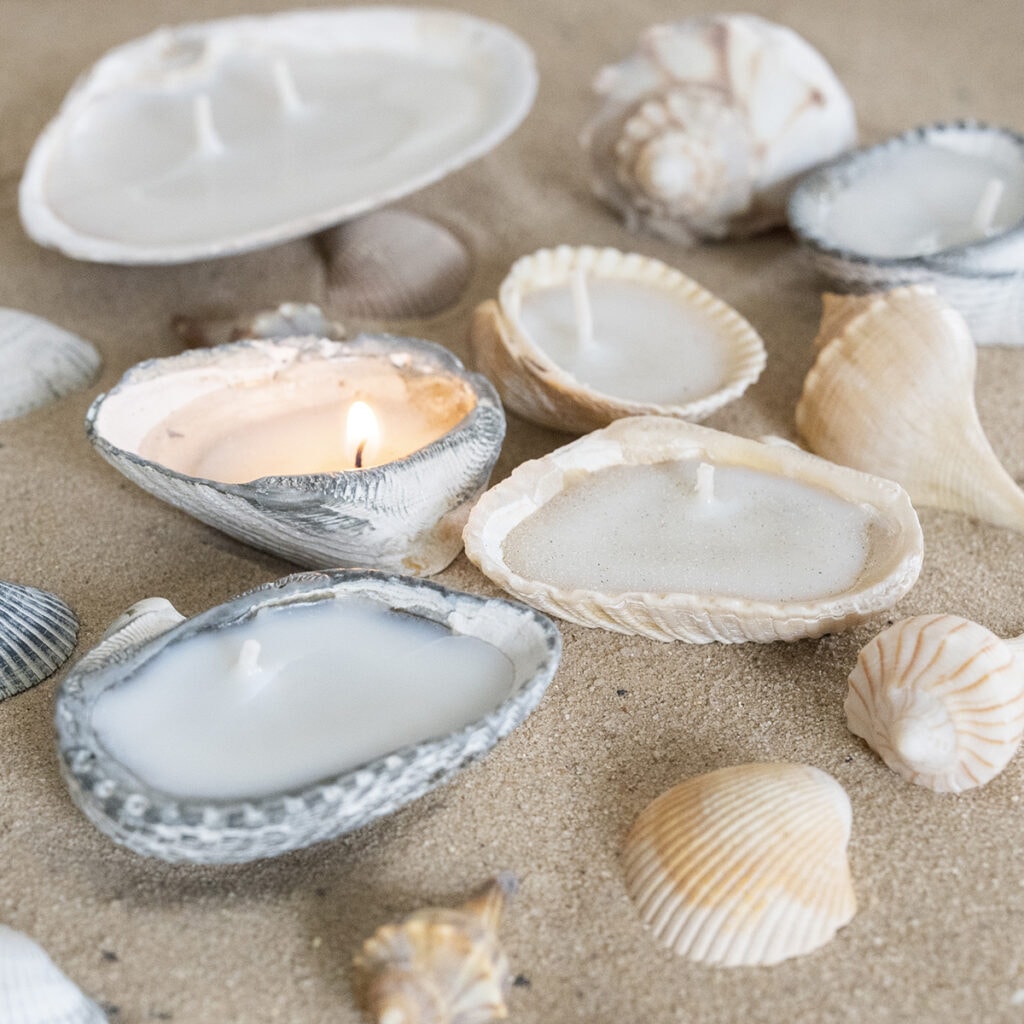 close-up of tea light candles in seashells