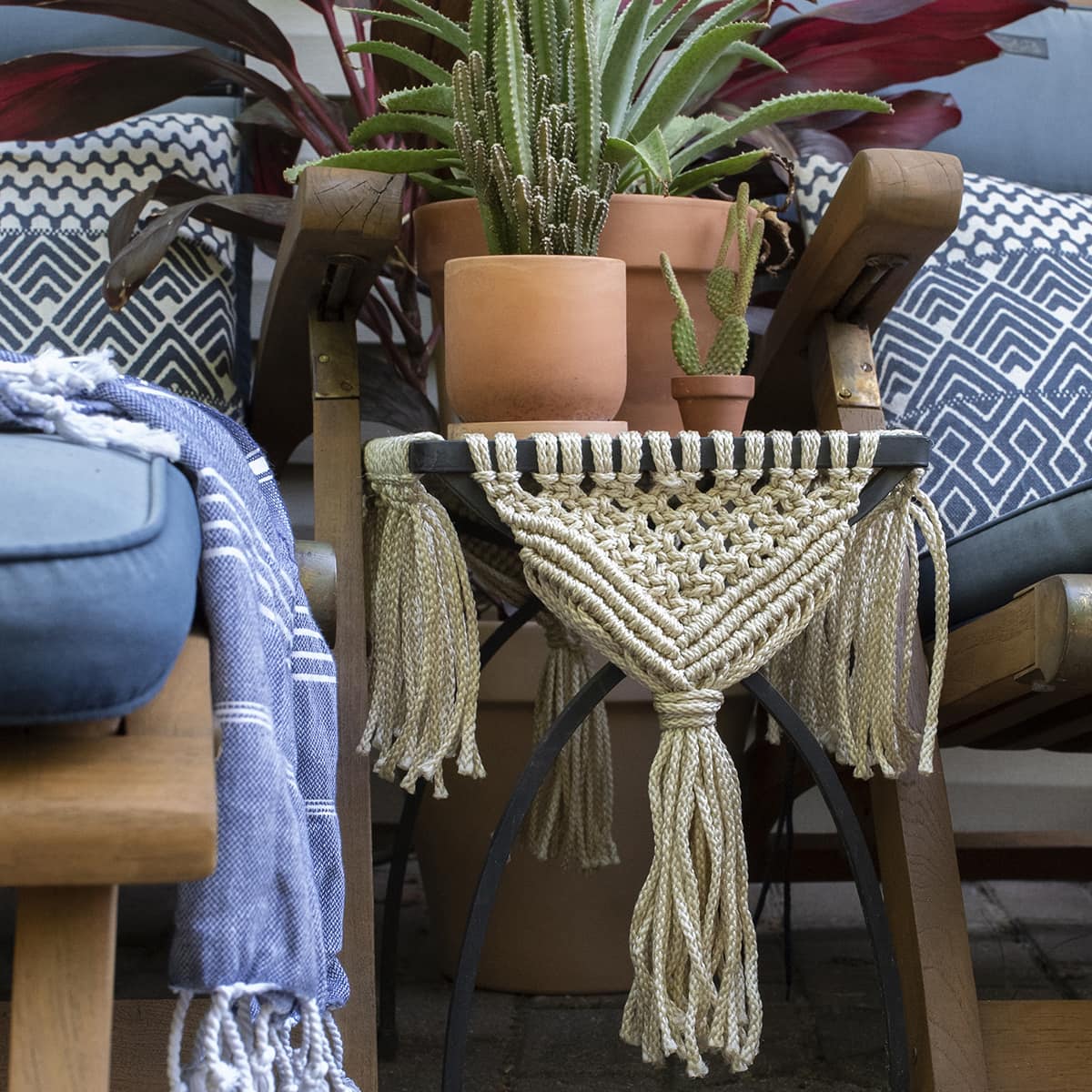 wooden lounge chairs with metal table with macrame details