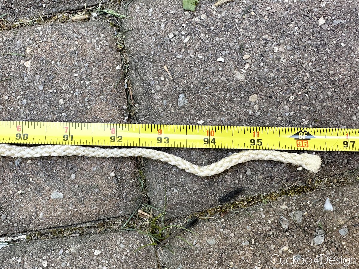 measuring tape next to unraveled yarn