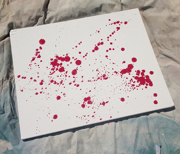 simple blood splatter painted on white canvas