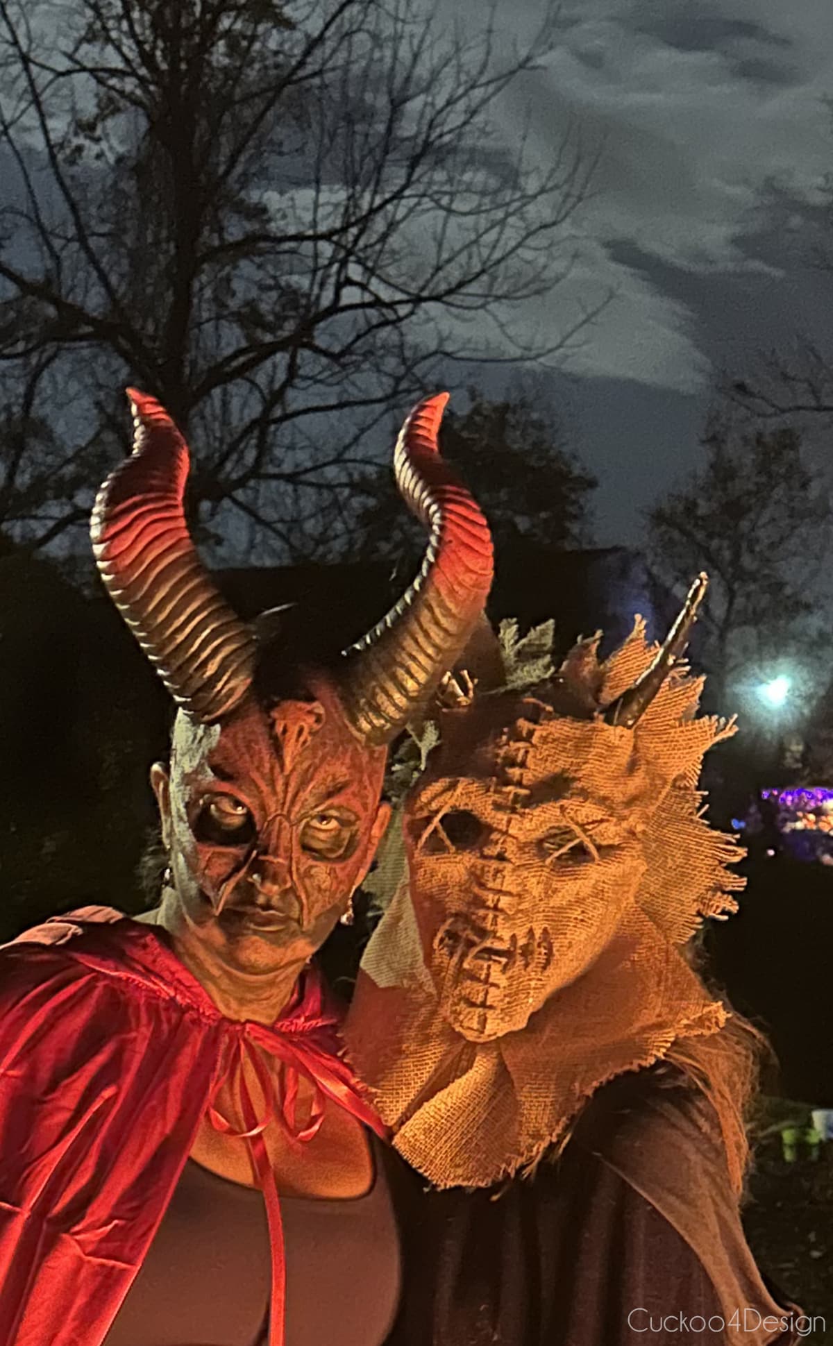 two costumes with horned masks