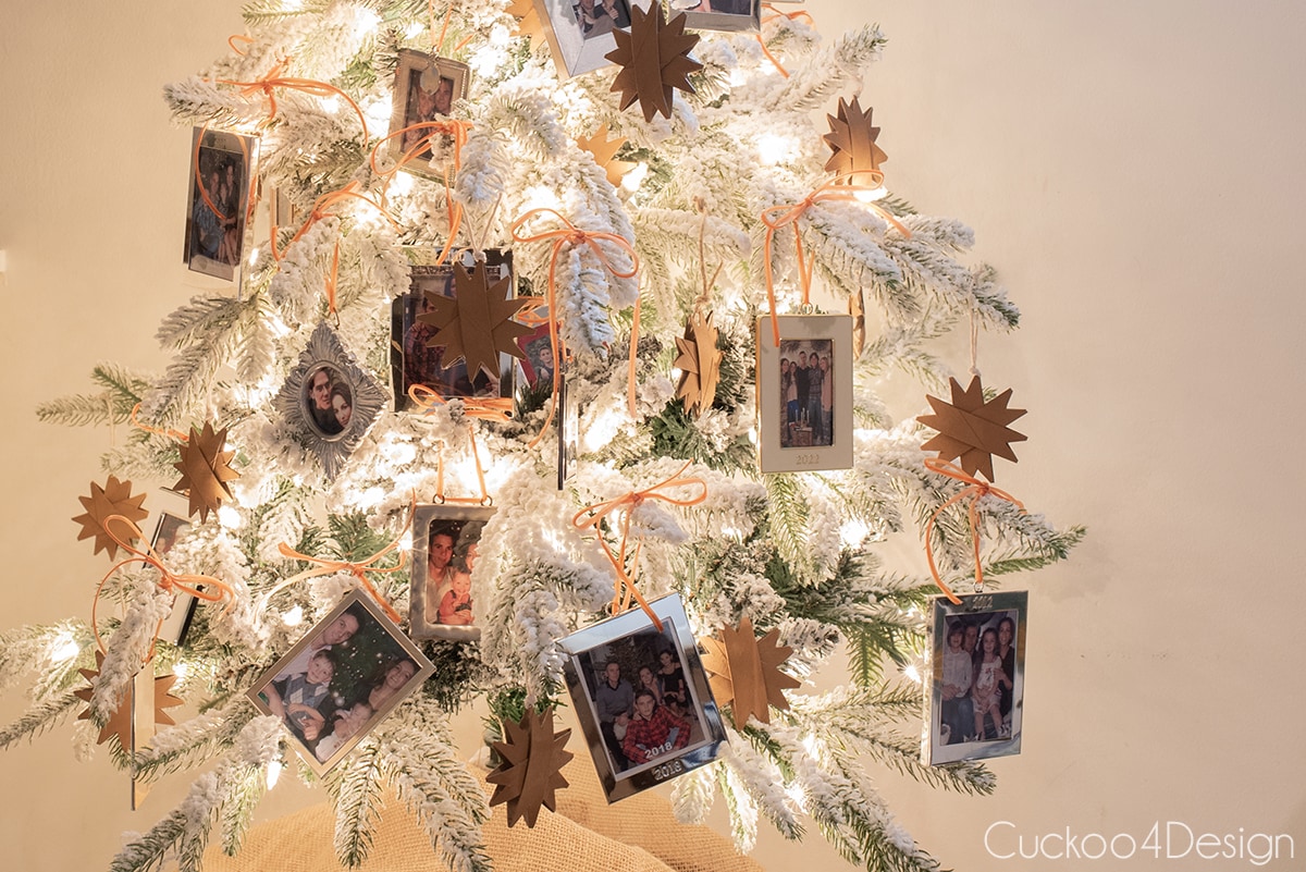 close-up of family frame ornaments on flocked Christmas tree